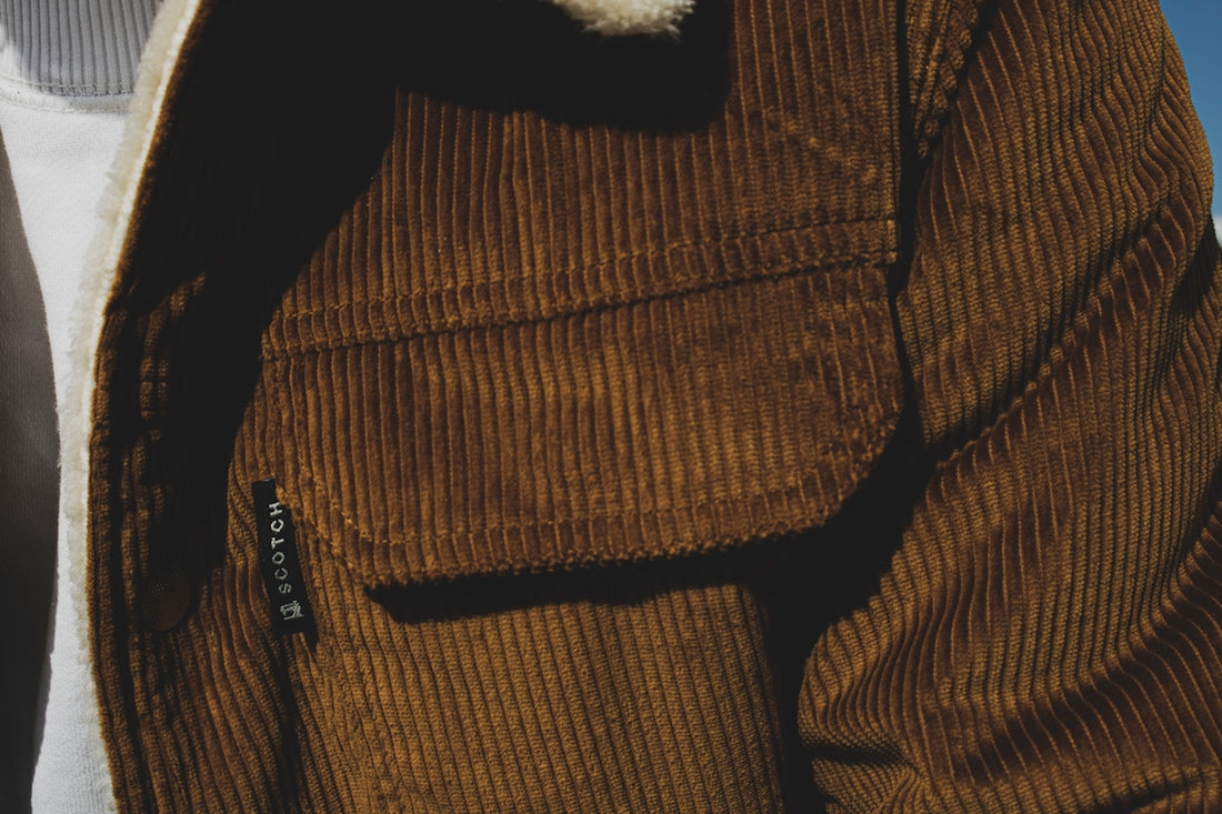 person wearing brown corduroy top