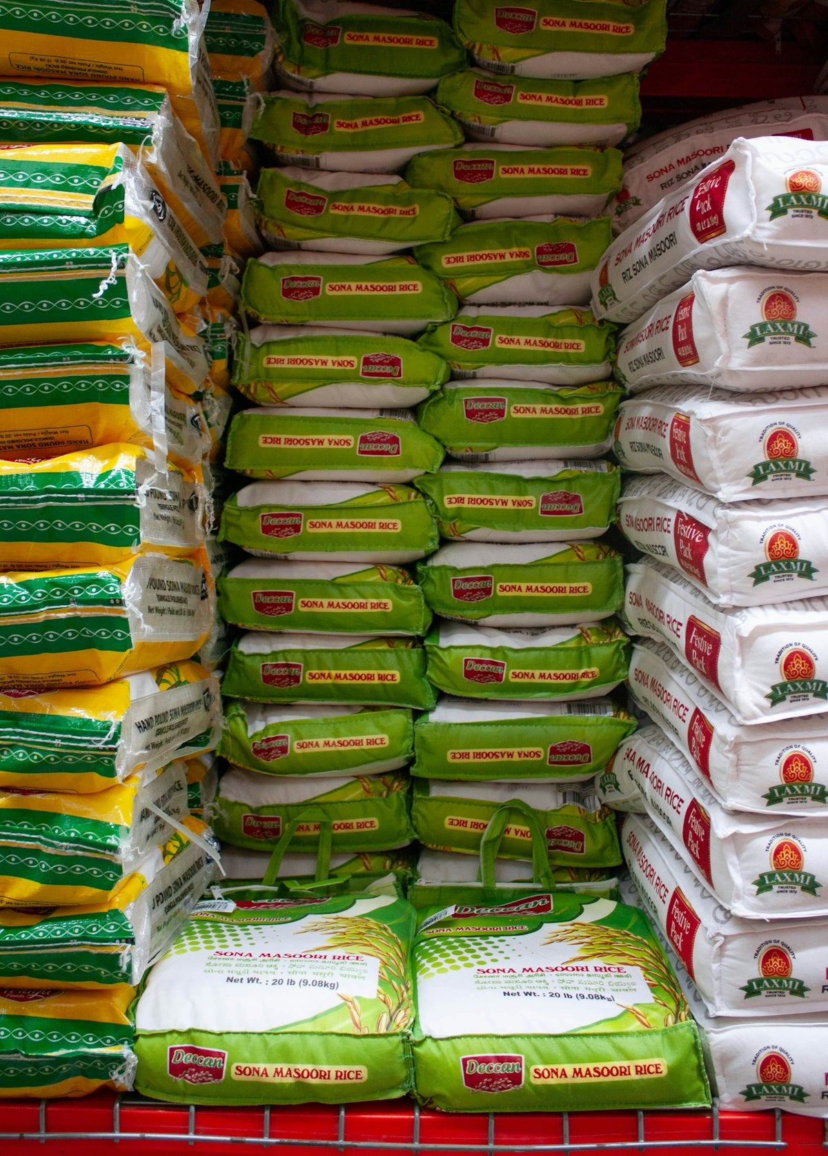 A grocery cart filled with lots of bags of food