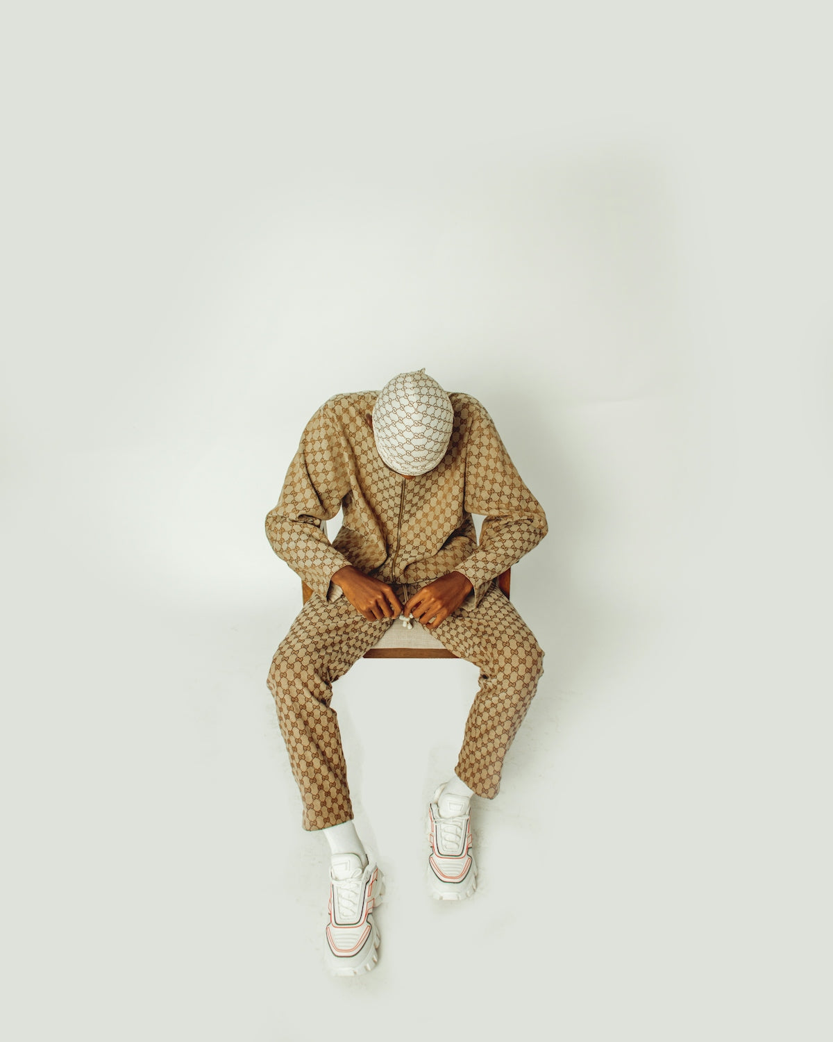A man in a suit sitting on a bench