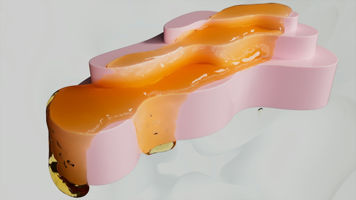 Orange glaze drips down a pink sculpture